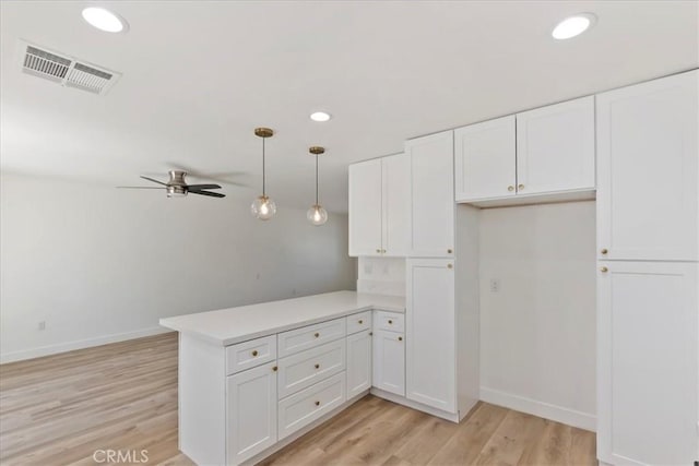 43000 Connecticut St, Palm Desert, CA 92211 - kitchen with a peninsula, ceiling fan, white cabinetry, light wood finished floors, and recessed lighting