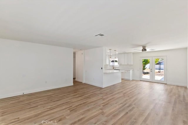 43000 Connecticut St, Palm Desert, CA 92211 - unfurnished living room featuring french doors, ceiling fan, and light wood-style flooring