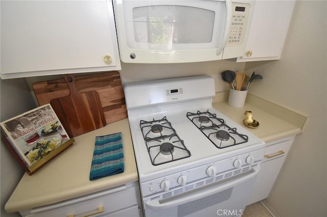 10246 Chaparral Way Unit G, Rancho Cucamonga, CA 91730 - kitchen featuring white appliances, light countertops, and white cabinetry