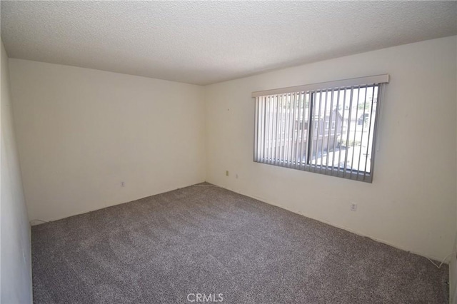 10246 Chaparral Way Unit G, Rancho Cucamonga, CA 91730 - carpeted empty room featuring a textured ceiling