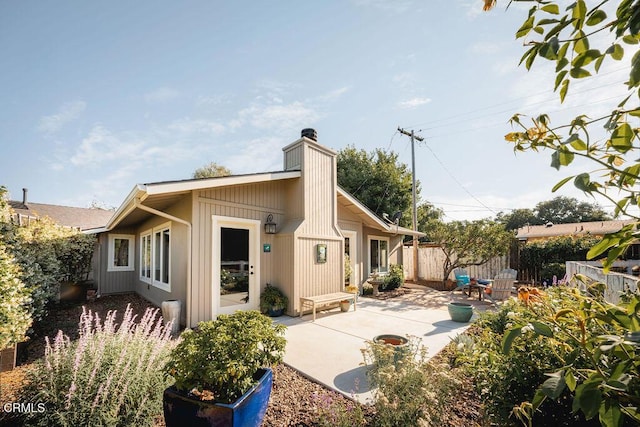 3041 Fairlea Rd, Santa Ynez, CA 93460 - back of property with a patio and a chimney