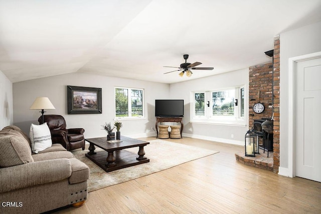 3041 Fairlea Rd, Santa Ynez, CA 93460 - living room with wood-type flooring, a ceiling fan, vaulted ceiling, and a wood stove