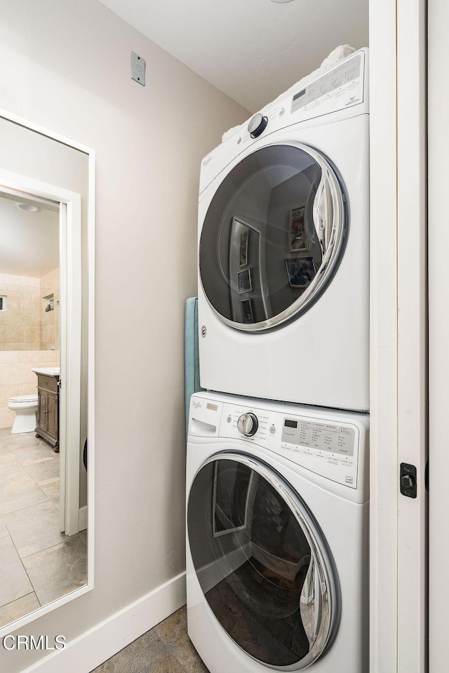 3041 Fairlea Rd, Santa Ynez, CA 93460 - washroom with stacked washer and clothes dryer and baseboards