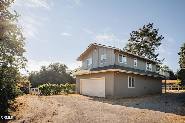 3041 Fairlea Rd, Santa Ynez, CA 93460 - view of property exterior with an attached garage and dirt driveway