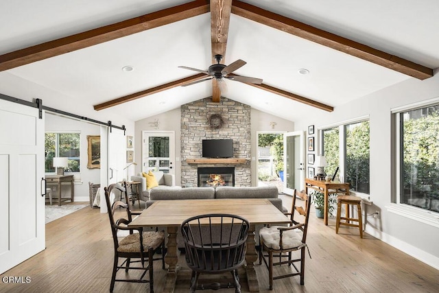 3041 Fairlea Rd, Santa Ynez, CA 93460 - dining room featuring light wood finished floors, plenty of natural light, a barn door, and a ceiling fan