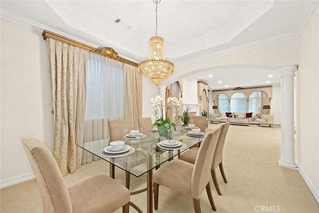 2832 Oak Knoll Dr, Diamond Bar, CA 91765 - dining area with light colored carpet, arched walkways, a chandelier, ornamental molding, and ornate columns