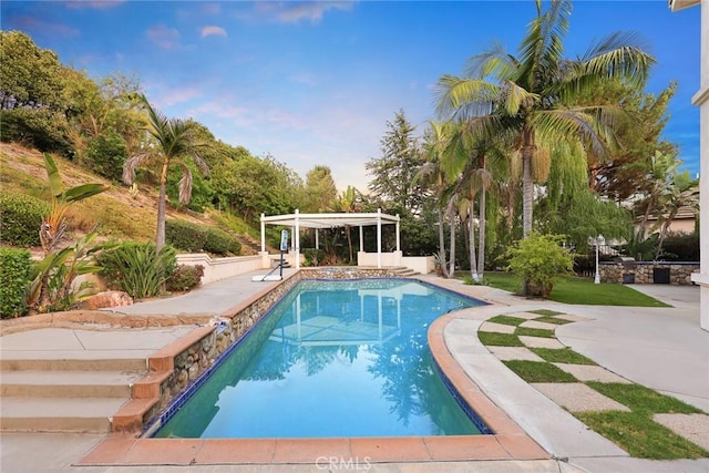 2832 Oak Knoll Dr, Diamond Bar, CA 91765 - pool at dusk with an outdoor pool, a patio area, and a pergola