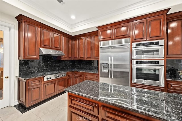 2832 Oak Knoll Dr, Diamond Bar, CA 91765 - kitchen with stainless steel appliances, under cabinet range hood, light tile patterned floors, dark stone counters, and decorative backsplash