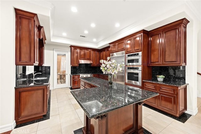 2832 Oak Knoll Dr, Diamond Bar, CA 91765 - kitchen featuring under cabinet range hood, light tile patterned flooring, a center island, tasteful backsplash, and crown molding