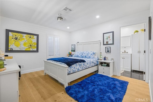25211 Dana Ln, Moreno Valley, CA 92551 - bedroom with light wood-style flooring, recessed lighting, and ensuite bathroom