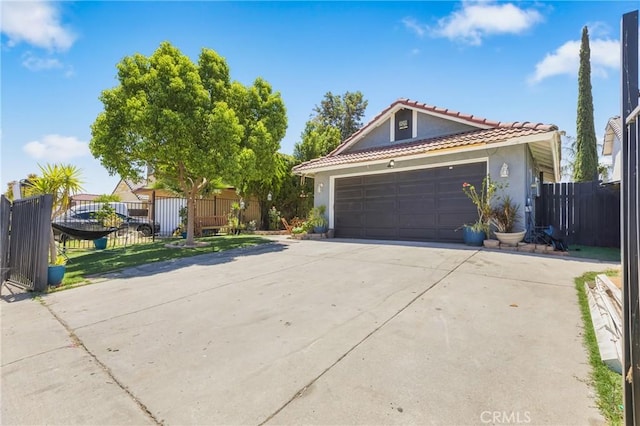 25211 Dana Ln, Moreno Valley, CA 92551 - view of front of house with stucco siding, driveway, a garage, and a tile roof