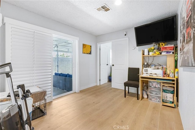 25211 Dana Ln, Moreno Valley, CA 92551 - living area with light wood-style flooring, a textured ceiling, and recessed lighting