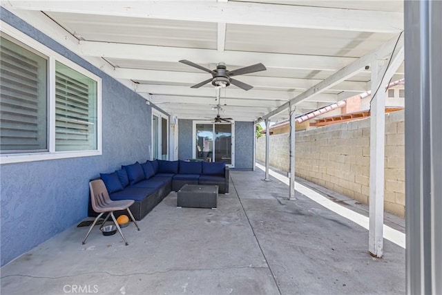 25211 Dana Ln, Moreno Valley, CA 92551 - fenced backyard with an outdoor living space, ceiling fan, and a patio area