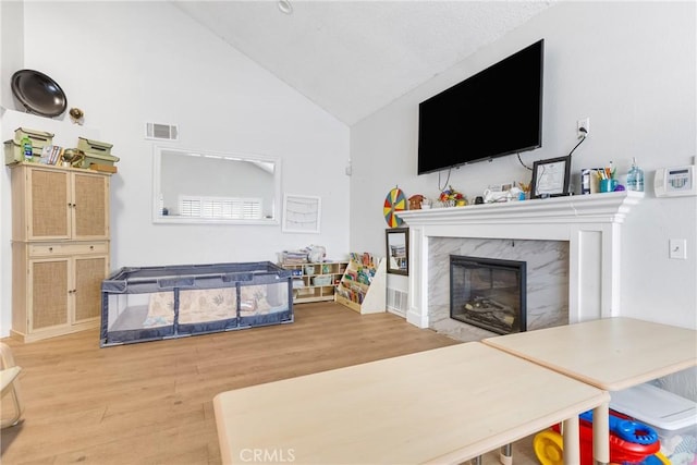 25211 Dana Ln, Moreno Valley, CA 92551 - living room with wood finished floors, a high end fireplace, and high vaulted ceiling