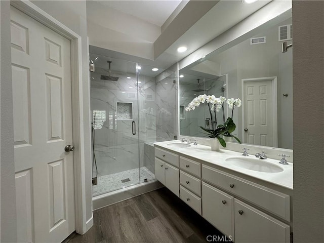 27721 Rubidoux, Mission Viejo, CA 92692 - full bath with a marble finish shower, double vanity, wood finished floors, and recessed lighting