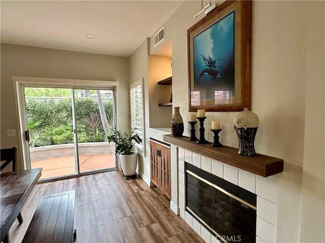27721 Rubidoux, Mission Viejo, CA 92692 - entryway with wood finished floors, a tiled fireplace, and recessed lighting