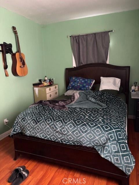 711 N Crane Ave, Compton, CA 90221 - bedroom featuring wood finished floors and baseboards