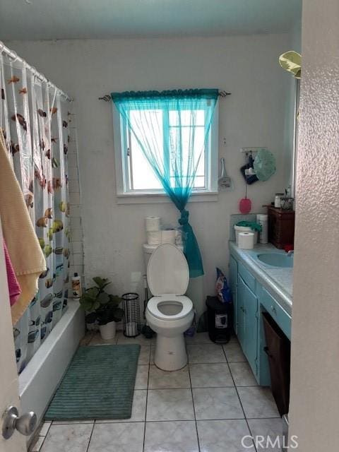711 N Crane Ave, Compton, CA 90221 - bathroom featuring tile patterned flooring, vanity, and shower / bath combo with shower curtain