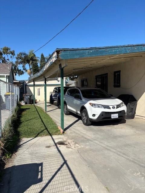 711 N Crane Ave, Compton, CA 90221 - view of vehicle parking featuring a carport