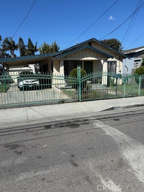 711 N Crane Ave, Compton, CA 90221 - bungalow-style home featuring a gate