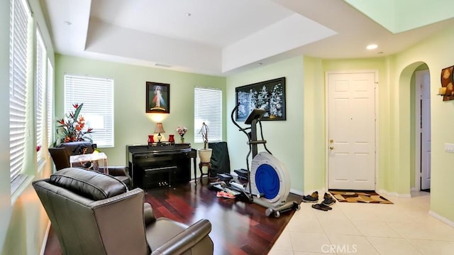 2056 Mission Hills Dr, Oxnard, CA 93036 - exercise area featuring arched walkways, a raised ceiling, recessed lighting, and tile patterned flooring