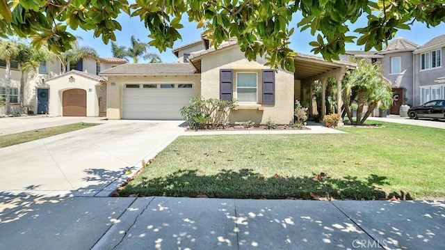2056 Mission Hills Dr, Oxnard, CA 93036 - view of front facade with stucco siding, a front lawn, driveway, a garage, and a tiled roof