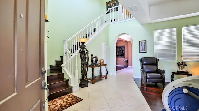 2056 Mission Hills Dr, Oxnard, CA 93036 - foyer entrance with arched walkways, stairway, and tile patterned floors
