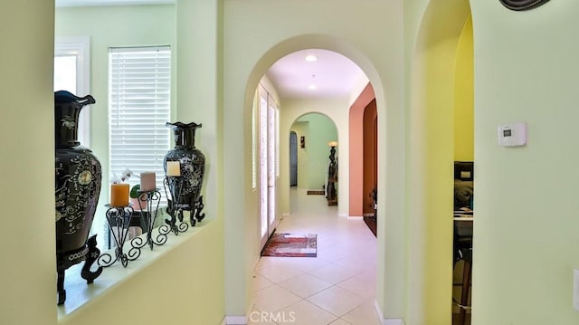 2056 Mission Hills Dr, Oxnard, CA 93036 - corridor featuring plenty of natural light, arched walkways, and tile patterned flooring