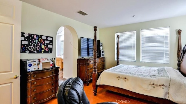 2056 Mission Hills Dr, Oxnard, CA 93036 - bedroom featuring light wood finished floors and arched walkways