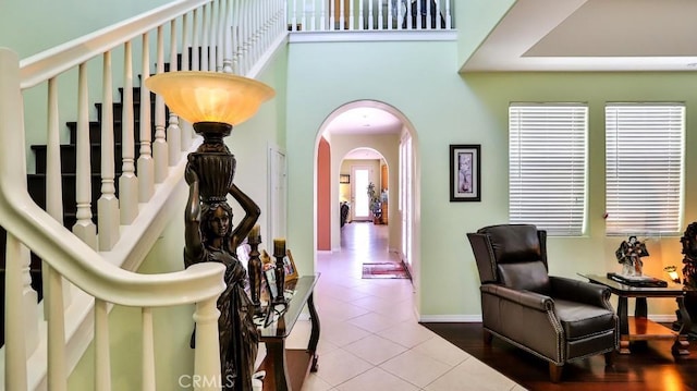 2056 Mission Hills Dr, Oxnard, CA 93036 - corridor with arched walkways, tile patterned flooring, and a towering ceiling