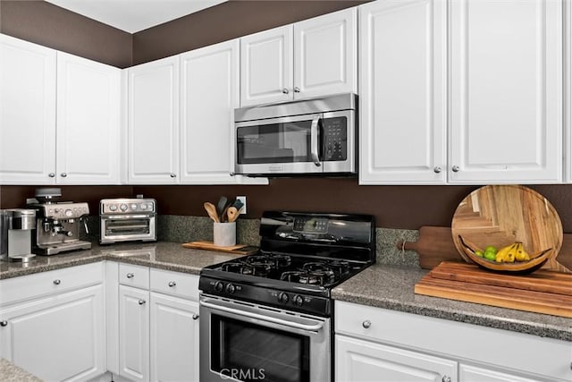775 Via Blairo, Corona, CA 92879 - kitchen featuring stainless steel appliances, white cabinetry, and dark countertops