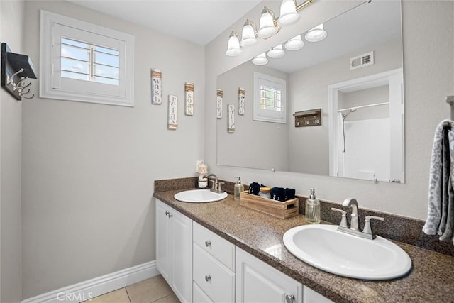 775 Via Blairo, Corona, CA 92879 - bathroom featuring double vanity, tile patterned flooring, and a shower