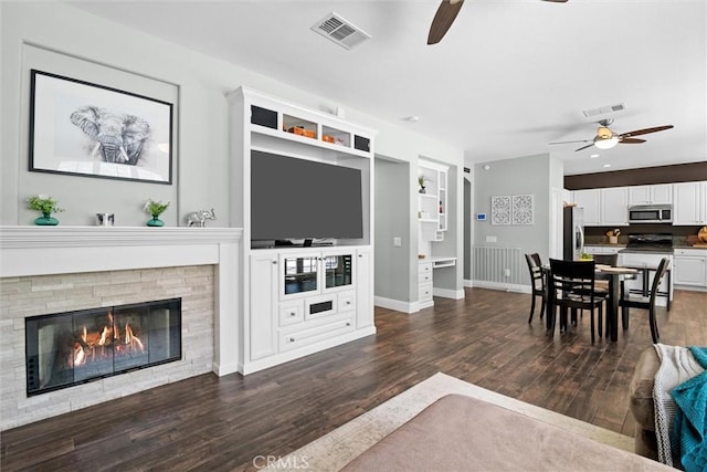 775 Via Blairo, Corona, CA 92879 - living room featuring a ceiling fan, dark wood-style floors, and a fireplace