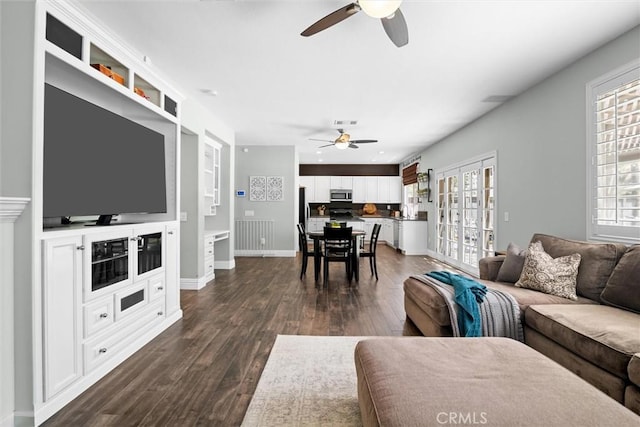 775 Via Blairo, Corona, CA 92879 - living room featuring ceiling fan, plenty of natural light, and dark wood-style flooring