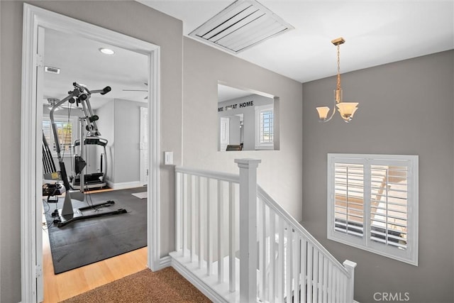 775 Via Blairo, Corona, CA 92879 - corridor featuring an upstairs landing, healthy amount of natural light, and a chandelier
