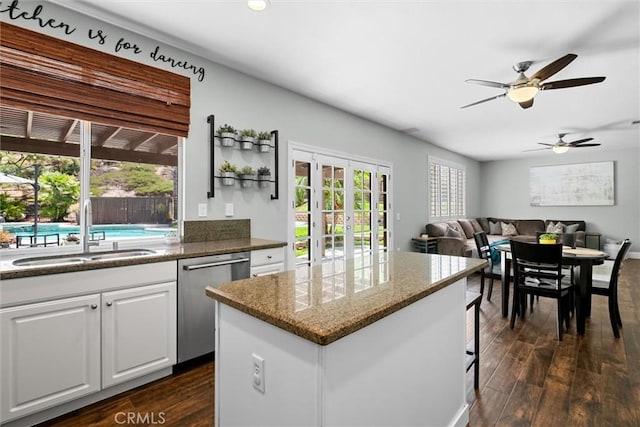 775 Via Blairo, Corona, CA 92879 - kitchen featuring dishwasher, dark wood-style flooring, a kitchen island, white cabinets, and recessed lighting