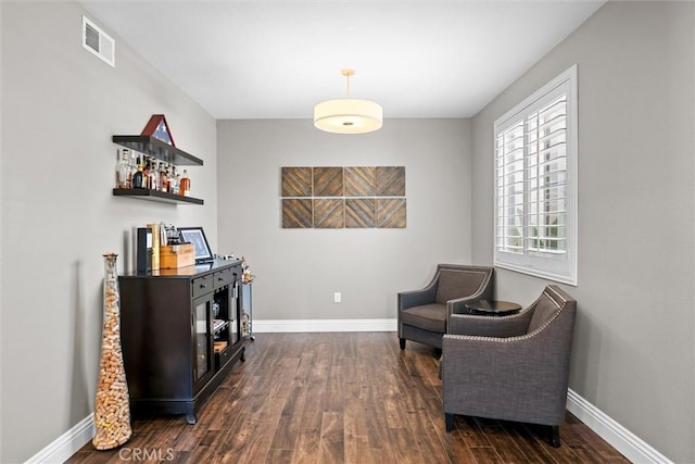 775 Via Blairo, Corona, CA 92879 - living area featuring dark wood-style flooring and baseboards