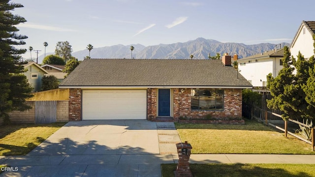 9465 E Camino Real Ave, Arcadia, CA 91007 - view of front of home featuring brick siding, a garage, a mountain view, driveway, and a shingled roof