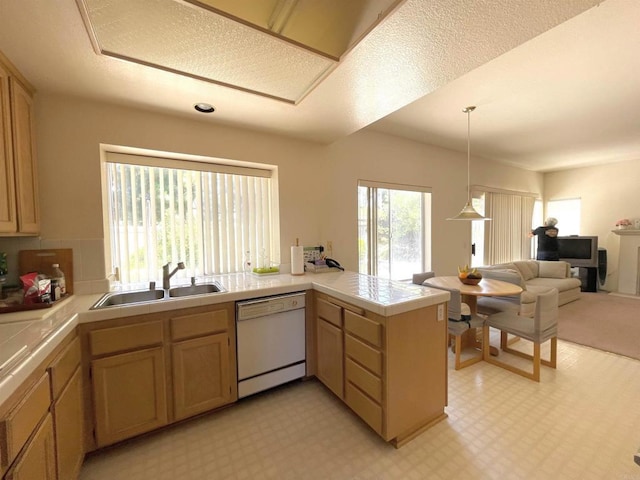 659 Rosita Ct, Chula Vista, CA 91910 - kitchen with dishwasher, a peninsula, open floor plan, decorative light fixtures, and light carpet