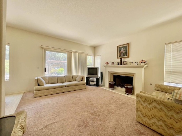 659 Rosita Ct, Chula Vista, CA 91910 - carpeted living area with a fireplace with flush hearth