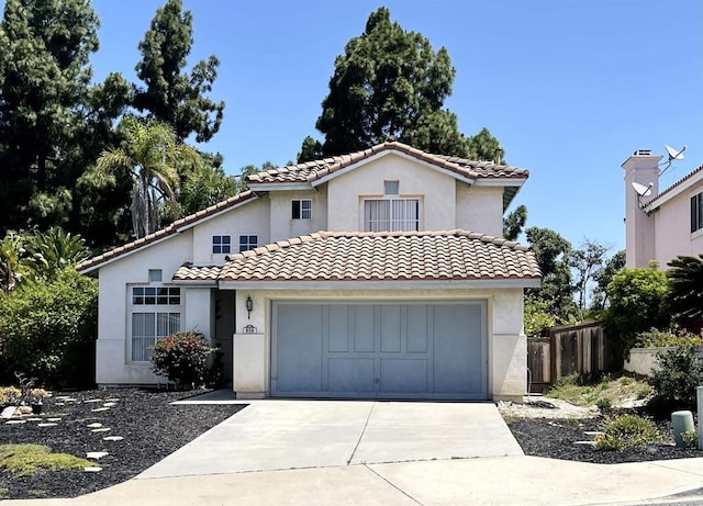 659 Rosita Ct, Chula Vista, CA 91910 - mediterranean / spanish-style home with driveway, an attached garage, stucco siding, and a tile roof