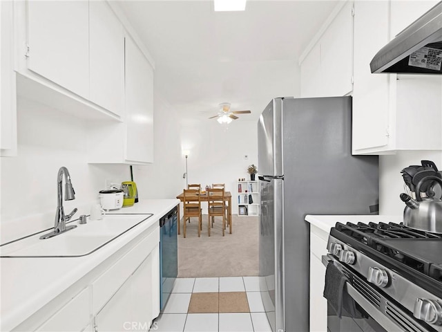 525 S Shelton St Unit 205, Burbank, CA 91506 - kitchen with wall chimney range hood, light carpet, dishwasher, light countertops, and a ceiling fan