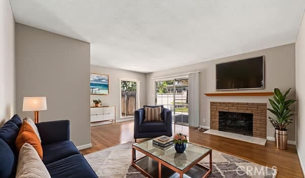 1724 S Vecino Ave, Glendora, CA 91740 - living room with wood finished floors and a fireplace