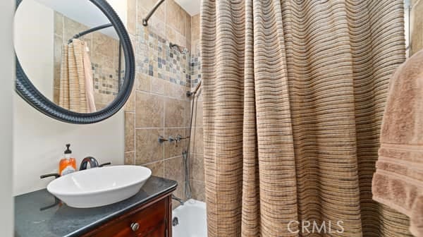 1724 S Vecino Ave, Glendora, CA 91740 - full bathroom featuring shower / bathtub combination with curtain and vanity