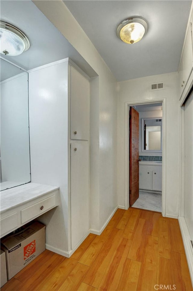 12108 Muriel Dr, Lynwood, CA 90262 - hall with light wood finished floors and baseboards
