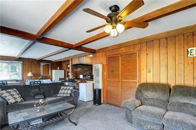 12108 Muriel Dr, Lynwood, CA 90262 - living room with carpet floors, beam ceiling, wood walls, ceiling fan, and a heating unit