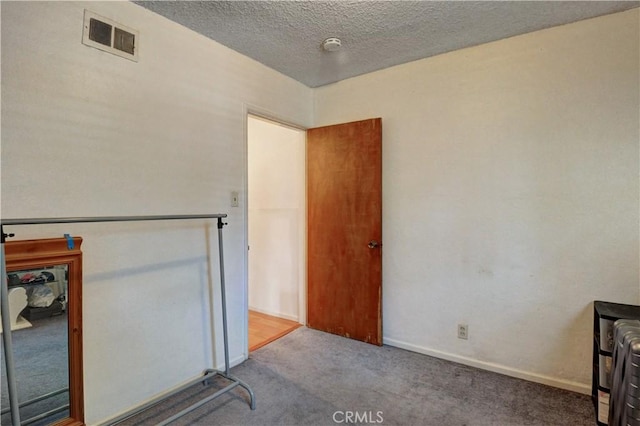 12108 Muriel Dr, Lynwood, CA 90262 - spare room with carpet and a textured ceiling