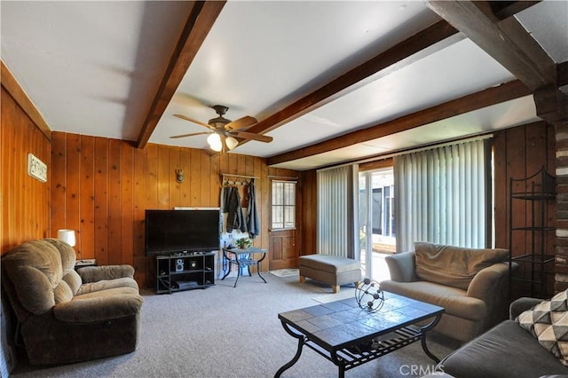 12108 Muriel Dr, Lynwood, CA 90262 - living room featuring beam ceiling, a ceiling fan, wood walls, and carpet floors