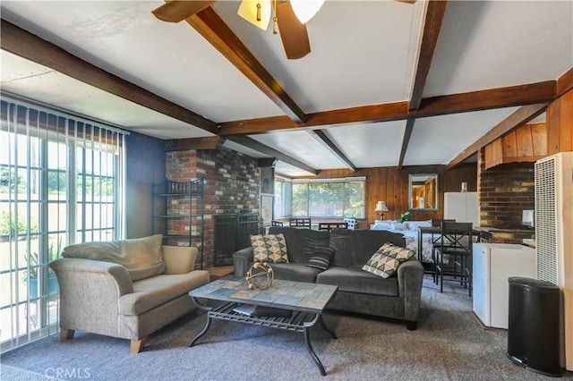 12108 Muriel Dr, Lynwood, CA 90262 - carpeted living area featuring beamed ceiling, ceiling fan, and a brick fireplace