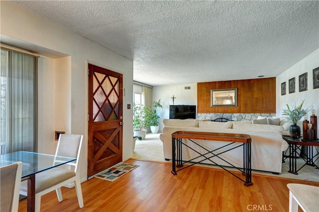 12108 Muriel Dr, Lynwood, CA 90262 - entrance foyer featuring light wood-type flooring and a textured ceiling